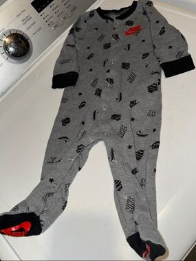 Nike Grey and Black Footed Baby One-Piece with Red Logo